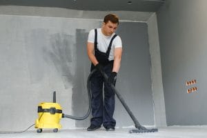 Worker Vacuuming